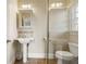 Small bathroom featuring pedestal sink and a glass shower door at 9070 Waits Ferry Xing, Johns Creek, GA 30097