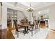 Spacious dining room boasts hardwood floors, coffered ceiling, modern lighting, and access to other rooms at 9070 Waits Ferry Xing, Johns Creek, GA 30097