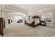 Large main bedroom with sitting area, fireplace, and ample natural light at 9070 Waits Ferry Xing, Johns Creek, GA 30097