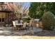 Outdoor dining area with seating, built-in grill, and view to the deck above at 9070 Waits Ferry Xing, Johns Creek, GA 30097