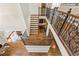 Aerial view of staircase with decorative iron railing and hardwood steps at 9070 Waits Ferry Xing, Johns Creek, GA 30097