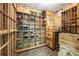 Climate-controlled wine cellar with custom wood racking and ample storage for a vast collection at 9070 Waits Ferry Xing, Johns Creek, GA 30097