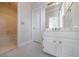 Bright bathroom features a tiled floor, modern vanity, large mirror, and a tub at 2650 Peachtree Battle Nw Pl, Atlanta, GA 30327