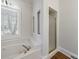 Bathroom featuring a soaking tub with jets and a stand-alone shower at 2650 Peachtree Battle Nw Pl, Atlanta, GA 30327