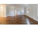 Spacious bedroom featuring hardwood floors, light walls, and multiple windows at 2650 Peachtree Battle Nw Pl, Atlanta, GA 30327