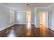 A well-lit bedroom showcases hardwood floors, crown molding, and a connecting hallway at 2650 Peachtree Battle Nw Pl, Atlanta, GA 30327