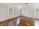 Bright bedroom with hardwood floors, ceiling fan, crown moulding, and natural light from multiple windows at 2650 Peachtree Battle Nw Pl, Atlanta, GA 30327