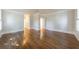 Bedroom featuring hardwood floors, white walls, and natural light at 2650 Peachtree Battle Nw Pl, Atlanta, GA 30327