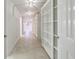 Hallway with tile floor features built-in bookshelves at 2650 Peachtree Battle Nw Pl, Atlanta, GA 30327