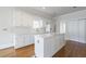 Bright kitchen with an island and white cabinets at 2650 Peachtree Battle Nw Pl, Atlanta, GA 30327