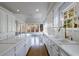 Bright kitchen with island, tile backsplash and stainless faucet at 2650 Peachtree Battle Nw Pl, Atlanta, GA 30327