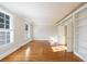 Bright living room with hardwood floors, windows, and built-in bookshelves, creating a cozy space at 2650 Peachtree Battle Nw Pl, Atlanta, GA 30327