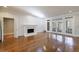 Living room features a fireplace, hardwood floors, and ample natural light at 2650 Peachtree Battle Nw Pl, Atlanta, GA 30327