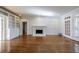 Living room with hardwood floors, fireplace, and built in shelves at 2650 Peachtree Battle Nw Pl, Atlanta, GA 30327