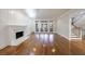 Spacious living room featuring a marble fireplace, hardwood floors and French doors at 2650 Peachtree Battle Nw Pl, Atlanta, GA 30327