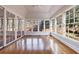 Sunroom featuring hardwood floors and windows offering natural light and views at 2650 Peachtree Battle Nw Pl, Atlanta, GA 30327