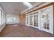 Charming sunroom with brick floor, skylight, ceiling fan, and multiple windows that brings in natural light at 2650 Peachtree Battle Nw Pl, Atlanta, GA 30327