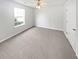 Bright bedroom with plush carpet, neutral walls, and ample natural light at 6782 Gina Agha Cir, Lithonia, GA 30038