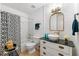 Stylish bathroom featuring shiplap walls, a unique vanity, and modern fixtures at 912 Santa Anita Dr, Woodstock, GA 30189