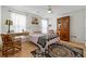 Bright bedroom with wood floors, vintage furniture, and lots of natural light at 912 Santa Anita Dr, Woodstock, GA 30189