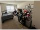 Bedroom featuring carpet floors and a double window that allows for ample lighting at 1720 Danville Dr, Mcdonough, GA 30253