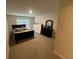 Bedroom with carpeted floors, a queen-size bed, a dresser, and a window providing natural light at 1720 Danville Dr, Mcdonough, GA 30253