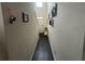 Hallway featuring laminate flooring, a stairway and access to the home's front door at 1720 Danville Dr, Mcdonough, GA 30253