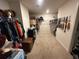 Spacious walk-in closet featuring carpet floors, clothing racks, and room for storage at 1720 Danville Dr, Mcdonough, GA 30253