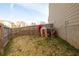 A backyard with a wooden fence and small playhouse at 2066 Charcoal Ives Rd, Lawrenceville, GA 30045