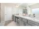 Modern bathroom showcasing double sinks, granite countertops, and a separate glass-enclosed shower at 2066 Charcoal Ives Rd, Lawrenceville, GA 30045