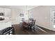 Bright dining area with wood floors, natural light and access to the backyard at 2066 Charcoal Ives Rd, Lawrenceville, GA 30045