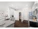 Open kitchen featuring granite countertops, modern appliances, and an adjacent pantry at 2066 Charcoal Ives Rd, Lawrenceville, GA 30045