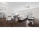 Spacious living room flowing into the dining area and kitchen with sleek stainless steel appliances at 2066 Charcoal Ives Rd, Lawrenceville, GA 30045