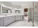 Elegant bathroom with double vanity, glass shower, and marble tile flooring at 3330 Valley Vista Se Rd, Smyrna, GA 30080