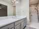 Bathroom featuring shower, quartz countertop and gray shaker cabinets at 3330 Valley Vista Se Rd, Smyrna, GA 30080