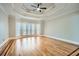 Large bedroom with tray ceiling, big windows, and hardwood flooring at 3330 Valley Vista Se Rd, Smyrna, GA 30080