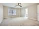 Bright, carpeted bedroom with ceiling fan and natural light coming through the window at 3330 Valley Vista Se Rd, Smyrna, GA 30080