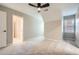 Carpeted bedroom with neutral paint, ceiling fan, and a window that provides plenty of natural light at 3330 Valley Vista Se Rd, Smyrna, GA 30080