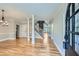 Welcoming entryway with hardwood floors, decorative columns, staircase, and natural light at 3330 Valley Vista Se Rd, Smyrna, GA 30080