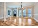 Elegant living room with hardwood floors, large windows, and a classic chandelier at 3330 Valley Vista Se Rd, Smyrna, GA 30080