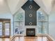 Living area featuring a fireplace, vaulted ceiling and french doors to the outside at 3330 Valley Vista Se Rd, Smyrna, GA 30080