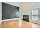 Spacious living room featuring a fireplace, custom wall accents, and hardwood floors at 3330 Valley Vista Se Rd, Smyrna, GA 30080