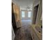 This bedroom features gray carpet, a ceiling fan, and two windows with a bathroom sink in the foreground at 400 Prince Of Wales, Stone Mountain, GA 30083