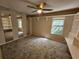 Bedroom with carpeted floor, a window, and a ceiling fan with lights at 400 Prince Of Wales, Stone Mountain, GA 30083