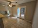 Inviting dining area with ceiling fan and outdoor access through double doors at 400 Prince Of Wales, Stone Mountain, GA 30083