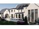 Expansive backyard with a sparkling pool, arched loggia and outdoor lounge perfect for luxurious outdoor living at 1580 Mayfield Rd, Alpharetta, GA 30009