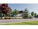 Inviting community entrance featuring manicured landscaping and a glimpse of modern architecture at 1580 Mayfield Rd, Alpharetta, GA 30009