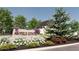 Mayfield Estates community sign surrounded by lush landscaping and a glimpse of modern home at 1580 Mayfield Rd, Alpharetta, GA 30009