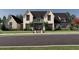 Charming two-story home with a stone and siding facade, complemented by mature landscaping at 1580 Mayfield Rd, Alpharetta, GA 30009