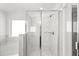 Modern bathroom boasting a glass shower and a separate soaking tub at 1818 Lacebark Elm Way, Lawrenceville, GA 30045